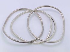 PLAIN 925 SILVER ROUND FORM BANGLES (3) - believed London 1959, 53.6grms, possibly by Kit Heath