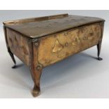 'ARTS & CRAFTS' COPPER CASKET - having a hinged lid and riveted corner supports on stylised feet,