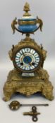 JAPY FRERES CO FRENCH GILT ORMOLU & PORCELAIN MANTEL CLOCK - having an urn finial and side masks