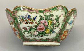 CIRCA 1900 CHINESE CANTON FAMILLE ROSE BOWL - having a lobed rim, the body with panels of people