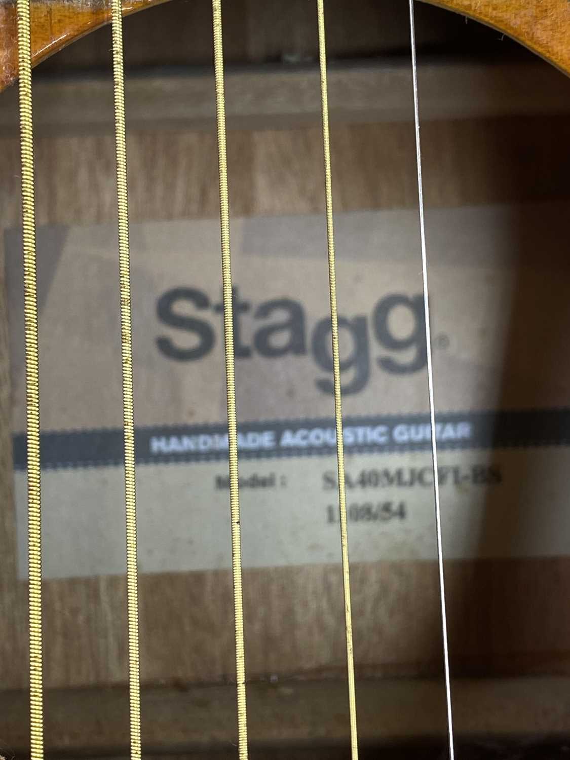 STAGG ACOUSTIC GUITAR & ONE OTHER along with a single guitar stand, interior label marked 'Stagg - Image 2 of 3