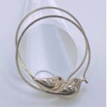 BELIEVED SILVER LOOP EARRINGS, A PAIR - each having a connection of a small bird with ruby eyes, 5.