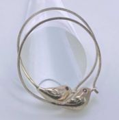 BELIEVED SILVER LOOP EARRINGS, A PAIR - each having a connection of a small bird with ruby eyes, 5.