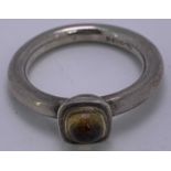CIRCULAR SILVER DRESS RING - with small cabochon citrine stone, 6.3grms, Size P, Marked M N