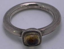 CIRCULAR SILVER DRESS RING - with small cabochon citrine stone, 6.3grms, Size P, Marked M N