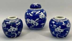 CHINESE PRUNUS PATTERN BLUE & WHITE GINGER JARS (3) - the larger with associated cover and four