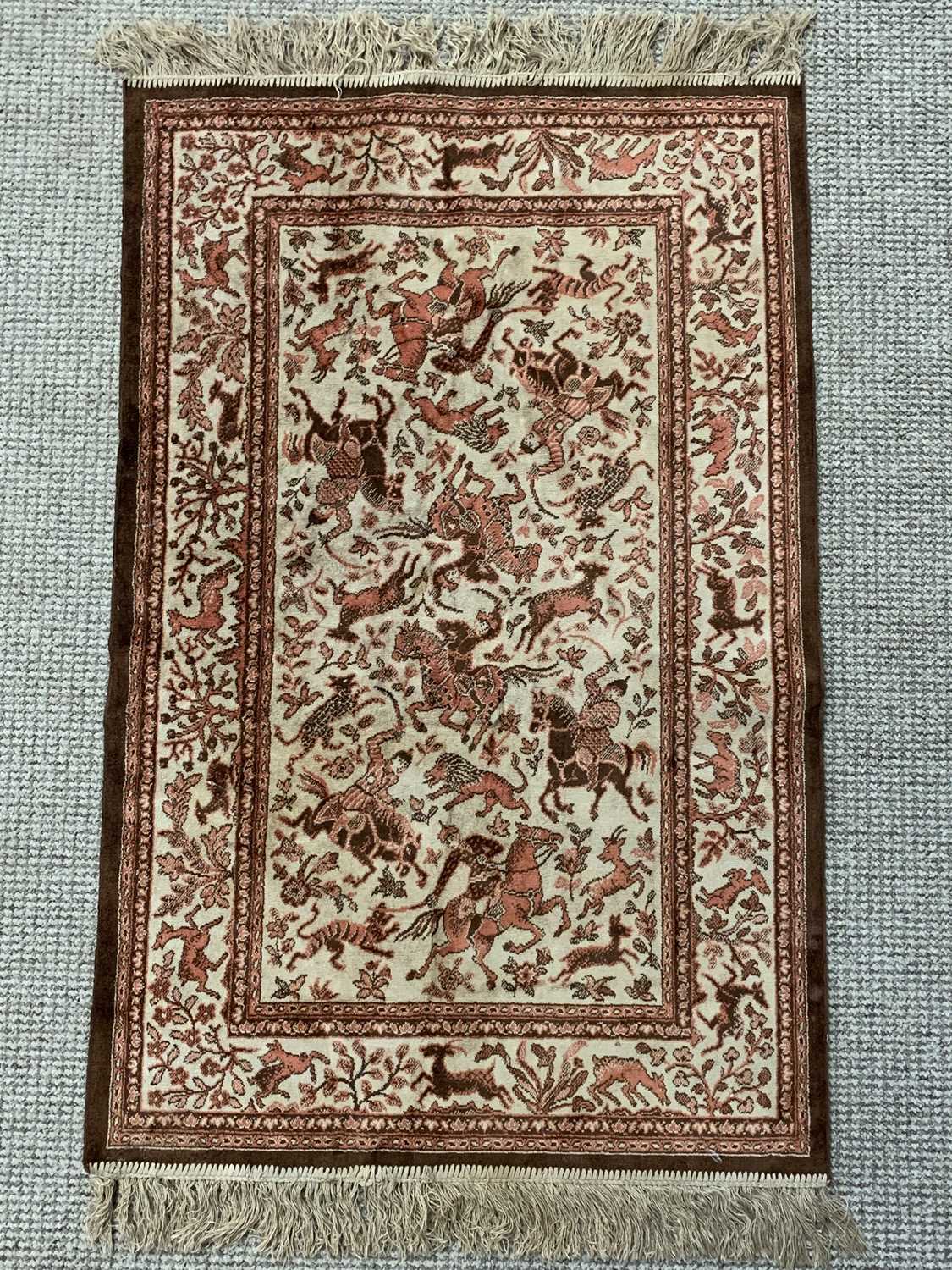 PERSIAN SILK STYLE RUG with animal patterned border and central hunt scene, 120 x 68cms - Image 2 of 3