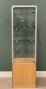 MODERN SQUARE COLUMN SHOP DISPLAY CABINET having a light wood base with single cupboard door under a