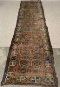 PERSIAN TYPE WOOLLEN CARPET RUNNER with repeating central block pattern and triple bordered edge,