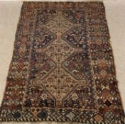 PERSIAN STYLE WOOLLEN RUG, multi-coloured with repeating pattern central block and multi-bordered