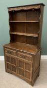 REPRODUCTION OAK DRESSER having carved detail to the two shelf rack over a base section with two