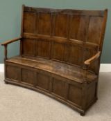 ANTIQUE ELM CURVED BACK BOX SEAT SETTLE, peg-joined construction having an eight panel back and open