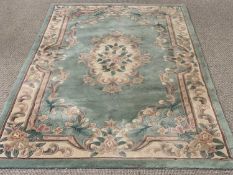 CHINESE "GREAT WALL" LABEL HAND WOVEN WASH WOOLLEN RUG, green ground with standard floral pattern