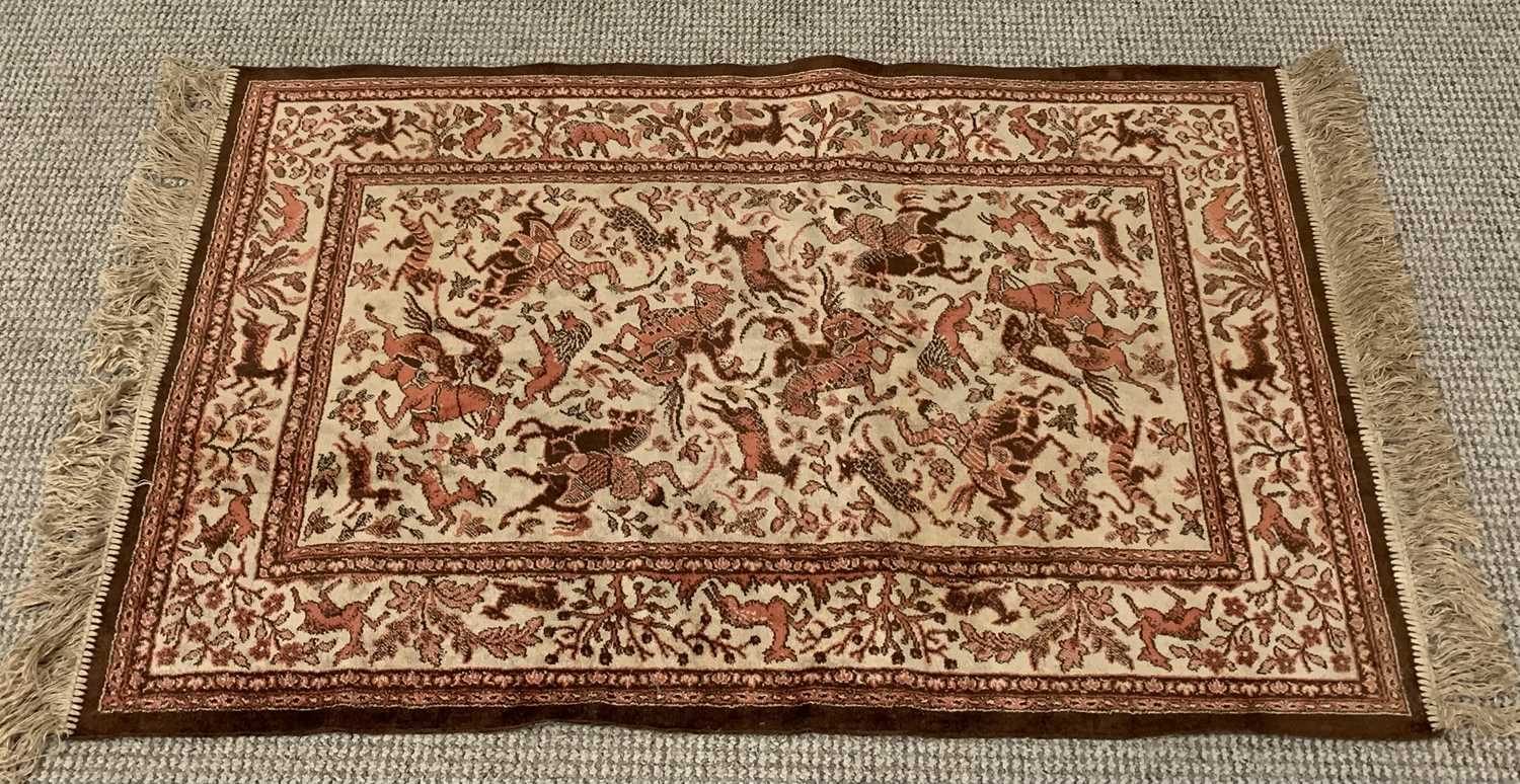 PERSIAN SILK STYLE RUG with animal patterned border and central hunt scene, 120 x 68cms