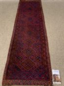 TURKISH WOOLLEN CARPET RUNNER , red and blue ground with repeating diamond pattern, 260 x 70cms