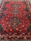 EASTERN TYPE WOOLLEN CARPET with triple diamond central pattern and multi-bordered edge to a