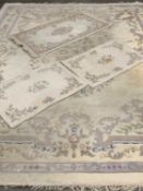LARGE & SMALL CHINESE WASHED WOOLLEN RUGS (4), all cream ground with traditional floral detail,