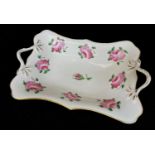 SWANSEA PORCELAIN TWIG-HANDLED CENTRE DISH decorated with a series of single pink roses and