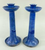 PAIR OF EWENNY POTTERY CANDLESTICKS in powder blue glaze, tapered and ribbed stems, circular