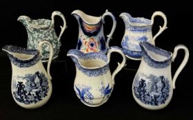 GROUP OF WELSH POTTERY TRANSFER DECORATED JUGS including Ynysmeudwy 'Floral I (Sheet Pattern)' in
