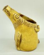 EWENNY ZOOMORPHIC POTTERY JUG in the form of a pig with elongated mouth to form spout, in yellow