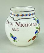 SWANSEA POTTERY NAMED JUG the front painted 'Ann Nicholas 1816' in brown and with sprays of flowers,