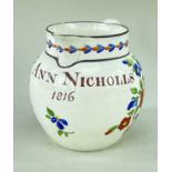 SWANSEA POTTERY NAMED JUG the front painted 'Ann Nicholas 1816' in brown and with sprays of flowers,