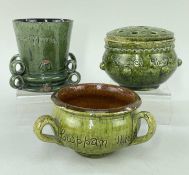 THREE EWENNY POTTERY VESSELS IN MOTTLED GREEN GLAZE comprising (1) a tyg, sgraffito inscribed 'Cwpan