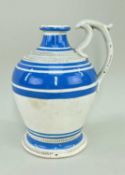 RARE YNYSMEUDWY POTTERY VINEGAR JAR having narrow neck and spurred handle to a footed baluster body,