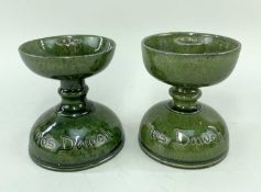 PAIR OF EWENNY CLAY PITS POTTERY CANDLE HOLDERS in variegated green glaze, sgraffito inscribed '