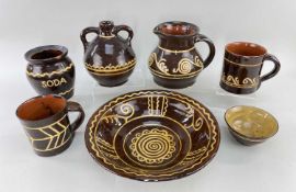 GROUP OF EWENNY POTTERY ITEMS, in brown glaze with yellow trailing slip decorationProvenance: