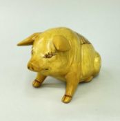 EWENNY POTTERY MODEL PIG raised over front legs, yellow glaze, ribs inscribed 'Y Mochyn' in a