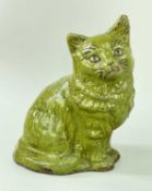 EWENNY CLAY PITS POTTERY MODEL OF A SEATED CAT in lime green glaze, sgraffito detail to face,