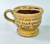 EWENNY POTTERY SHAVING MUG in yellow glaze, with loop handle, the bowl halfed into shallow and