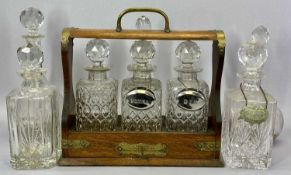 TANTALUS - vintage oak three bottle, no makers marks, with key and bottom slide opening mechanism,