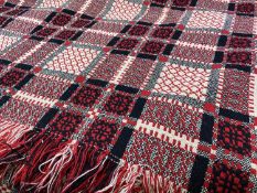 TRADITIONAL WELSH WOOLLEN BLANKET - with tasselled ends in reds, blacks and whites, an excellent