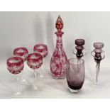 BOHEMIA TYPE RED GLASS DECANTER WITH STOPPER, 38cms tall and four similar style hock glasses, a pair