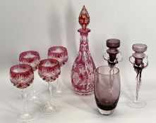 BOHEMIA TYPE RED GLASS DECANTER WITH STOPPER, 38cms tall and four similar style hock glasses, a pair