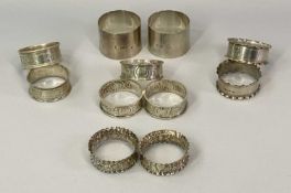SILVER NAPKIN RINGS, 4 PAIRS plus a matching group of three, London, Birmingham and Chester
