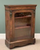 ANTIQUE WALNUT PIER CABINET with metallic maiden motifs flanking an arched top glazed door, 109cms