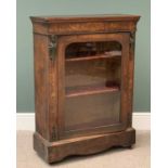 ANTIQUE WALNUT PIER CABINET with metallic maiden motifs flanking an arched top glazed door, 109cms