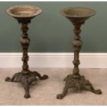 VICTORIAN CAST IRON BIRD BATHS, a pair, on tripod bases, 74cms H, 30cms diameter