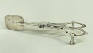 UNUSUAL PAIR GEORGE III CRESTED SILVER CANDLE SNUFFERS, Thomas Radcliffe, London 1817, canted