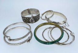 SILVER & WHITE METAL BANGLES comprising five marked silver, white metal filigree example, pair of