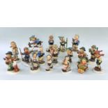 ASSORTED HUMMEL GOEBEL PORCELAIN FIGURES OF CHILDREN, engaged in various sporting and recreational