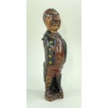 19TH CENTURY FOLK ART FIGURE, of a gent. in frock coat, painted details, inset glass eyes, 25cm h