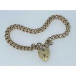 9CT GOLD CURB LINK BRACELET, heart shaped padlock, 17.1gms, in David Evans & Sons of Cardigan square