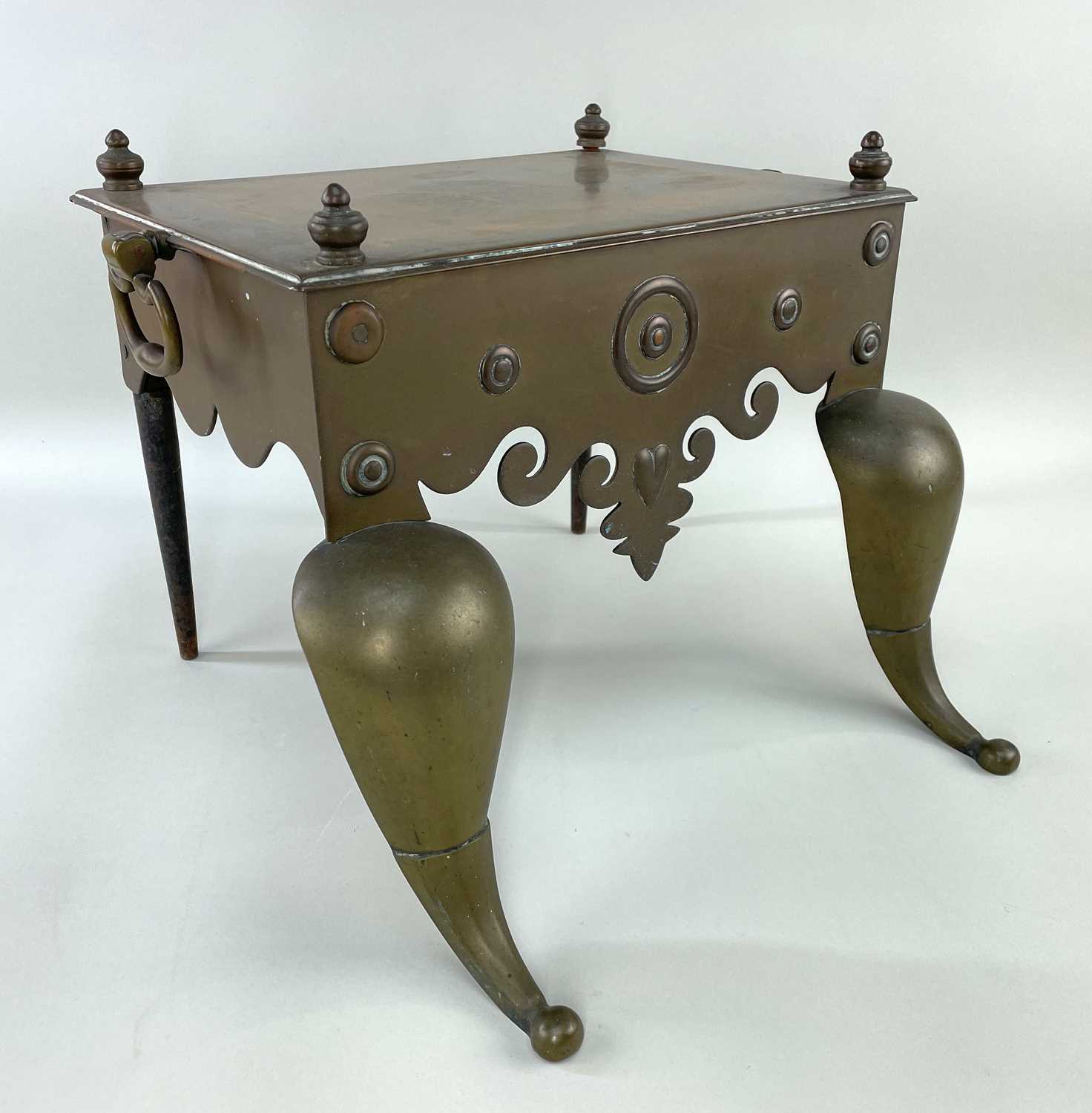 19TH CENTURY BELL METAL FOOTMAN, the shaped cut card apron with embossed heart motif, hinged side
