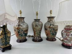 FIVE MODERN ORIENTAL-STYLE TABLE LAMPS, including a set of three, all with white/cream shades and