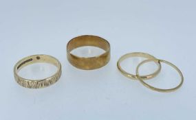 GOLD RINGS comprising two 18ct gold bands (4.0gms), together with two 9ct gold bands (3.8gms) (4)